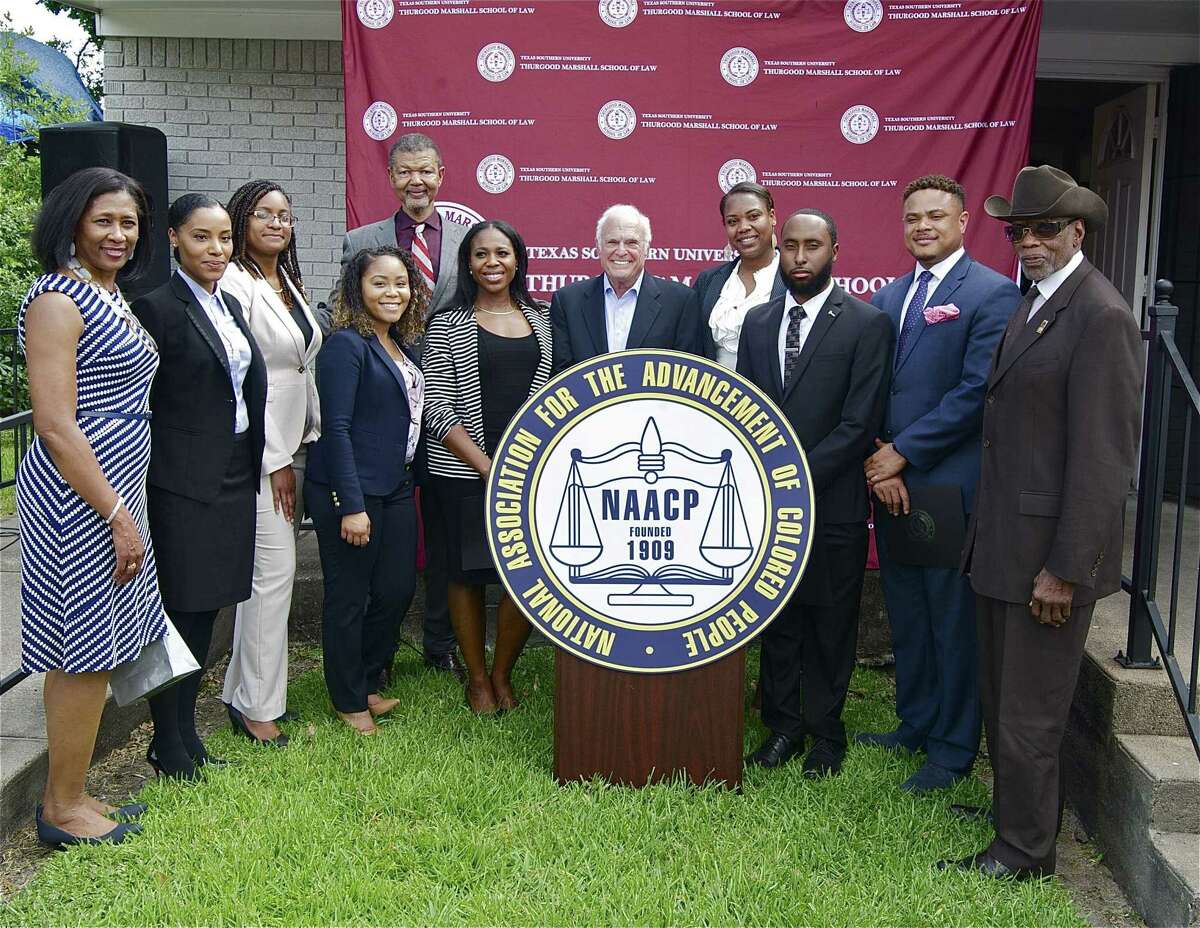Acting dean of the Thurgood Marshall School of Law Gary Bledsoe, back row, celebrates the opening of the Legal Entrepreneurship Incubator wth NAACP Houston Executive Director Yolanda Smith, joins Taren Marsaw, Lashay Hopkins, Brittani Armstrong, Jessica Akiode, Sam Stolbun, Brandy Douglas, Marcus Esther, Chigozirim Nwaogwugwu,  and NAACP Houston President James Douglas. The incubator will help seven recent law school graduates set up solo practices to serve the Third Ward in Houston.