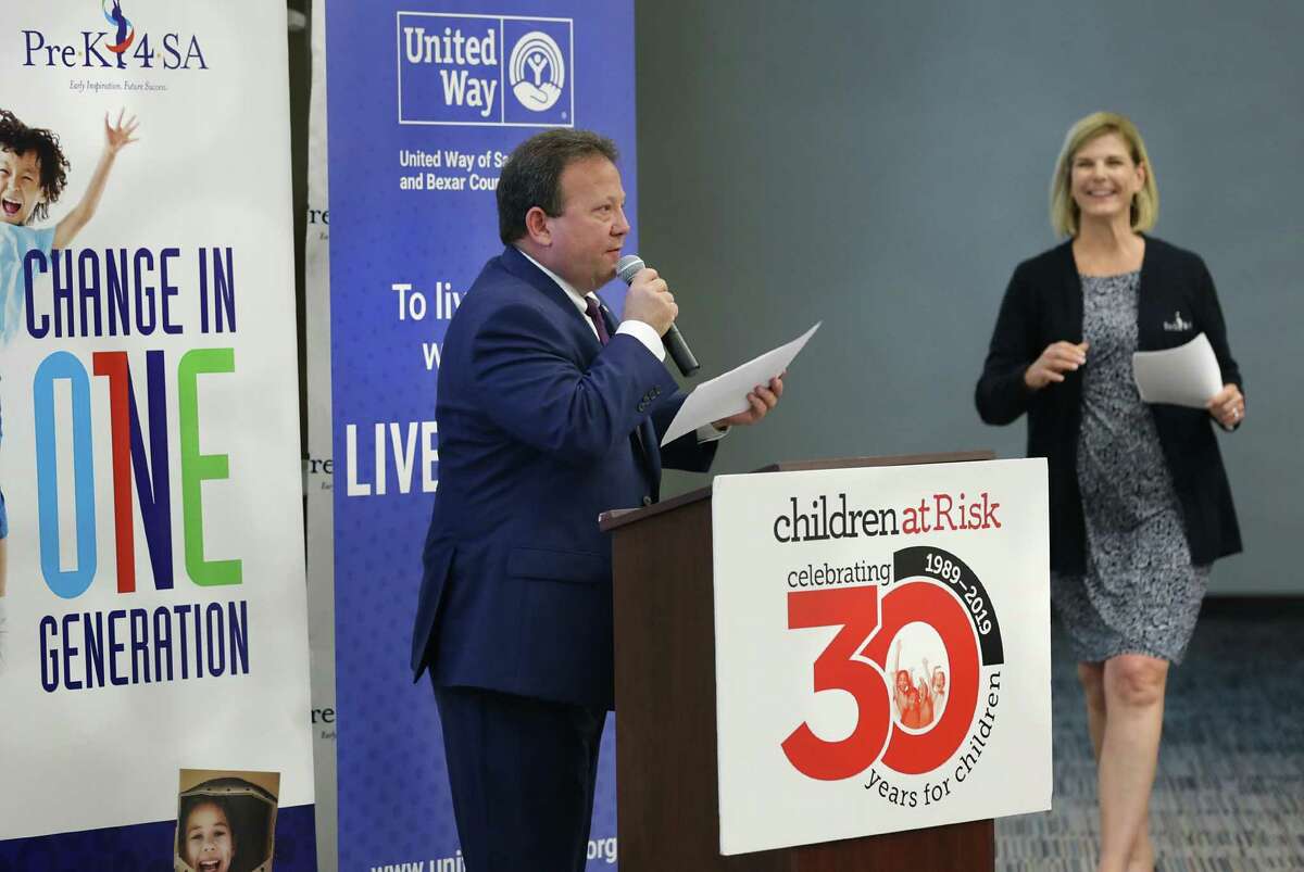Chris Martin, left, President and CEO of United Way, speaks at a meeting of child care providers. At right is Sarah Baray, CEO of Pre-K 4 SA, which joined with Children at Risk and United Way of San Antonio and Bexar County to create the Shared Services Alliance to reduce costs for child care providers. The event was held Thursday, June, 6, 2019at Pre-K4 SA East Center.