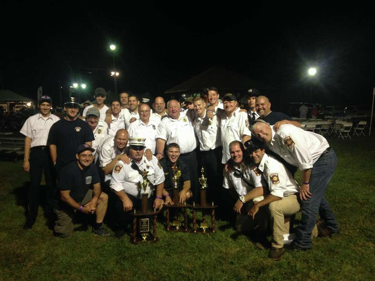 Members of the White Hills and Huntington Fire Companies celebrate their trophies at the Bridgewater Fair parade on Aug. 21. (Photo courtesy of the Shelton Fire Department)