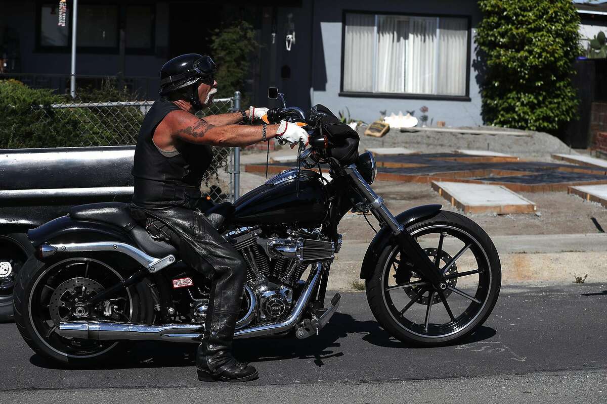 Steve Johnson sits on his motorcycle in front of his home where he has constructed a design in his yard that resembles a swastika on June 5, 2019 in El Sobrante, Calif. (Justin Sullivan/Getty Images/TNS)