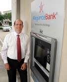 Ray Vitulli, COO of Allegiance Bank, stands by a new ATM near the company offices Friday May 31, 2019.(Dave Rossman Photo)