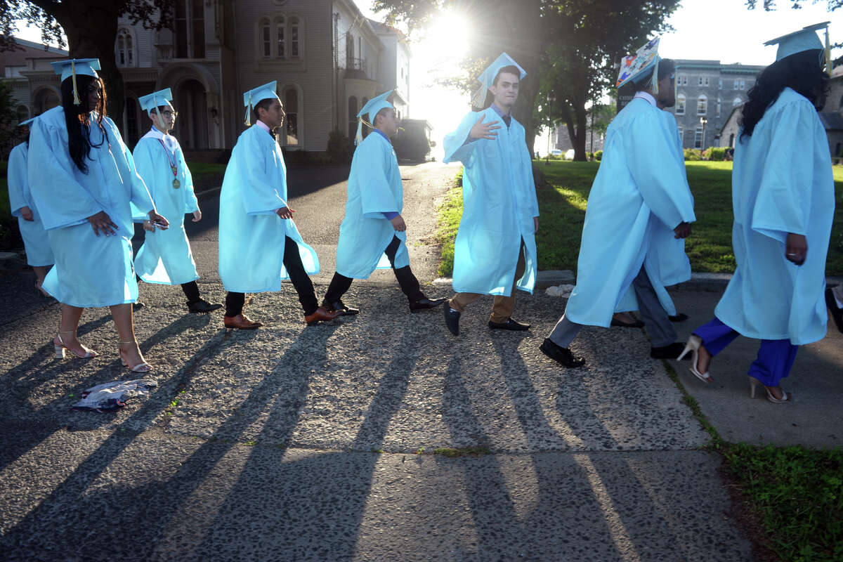 The Kolbe Cathedral High School Class of 2019 walks from their school to St. Augustine Cathedral for their graduation in Bridgeport, Conn. June 6, 2019.