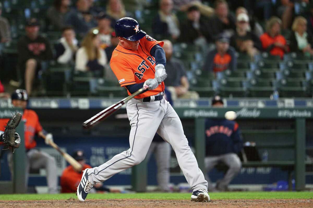 Myles Straw slugs the triple that led to the Astros' winning run in the 14th inning of Thursday's victory at Seattle.