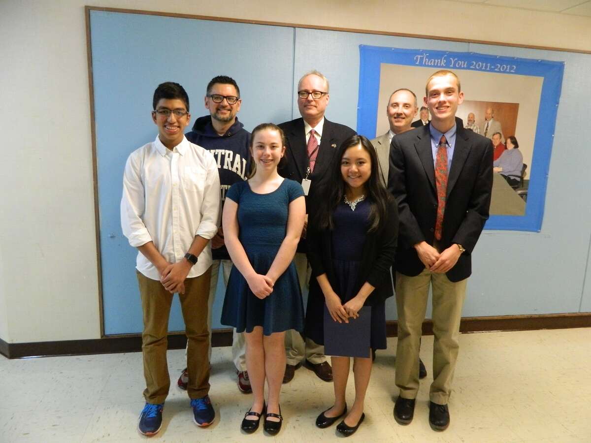 CABE award winners (front row) Siddharth Jain, Brynn Conrad, Alyssa Lam, and Billy Simics. Back Row: Kenneth Saranich, Superintendent Clouet, and Jim Colandrea