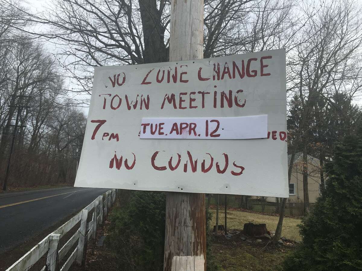 Residents along Long Hill Ave. touched up their homemade signs they made alerting neighbors of the potential development.