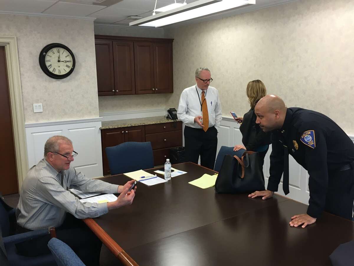 (Left to right)Mayor Mark Lauretti talks with Chief Shawn Sequeira as Superintendent Dr. Chris Clouet speaks with Pam Mautte following a meeting discussing their approach to preventing opioid abuse in the community. - Aaron Berkowitz photo