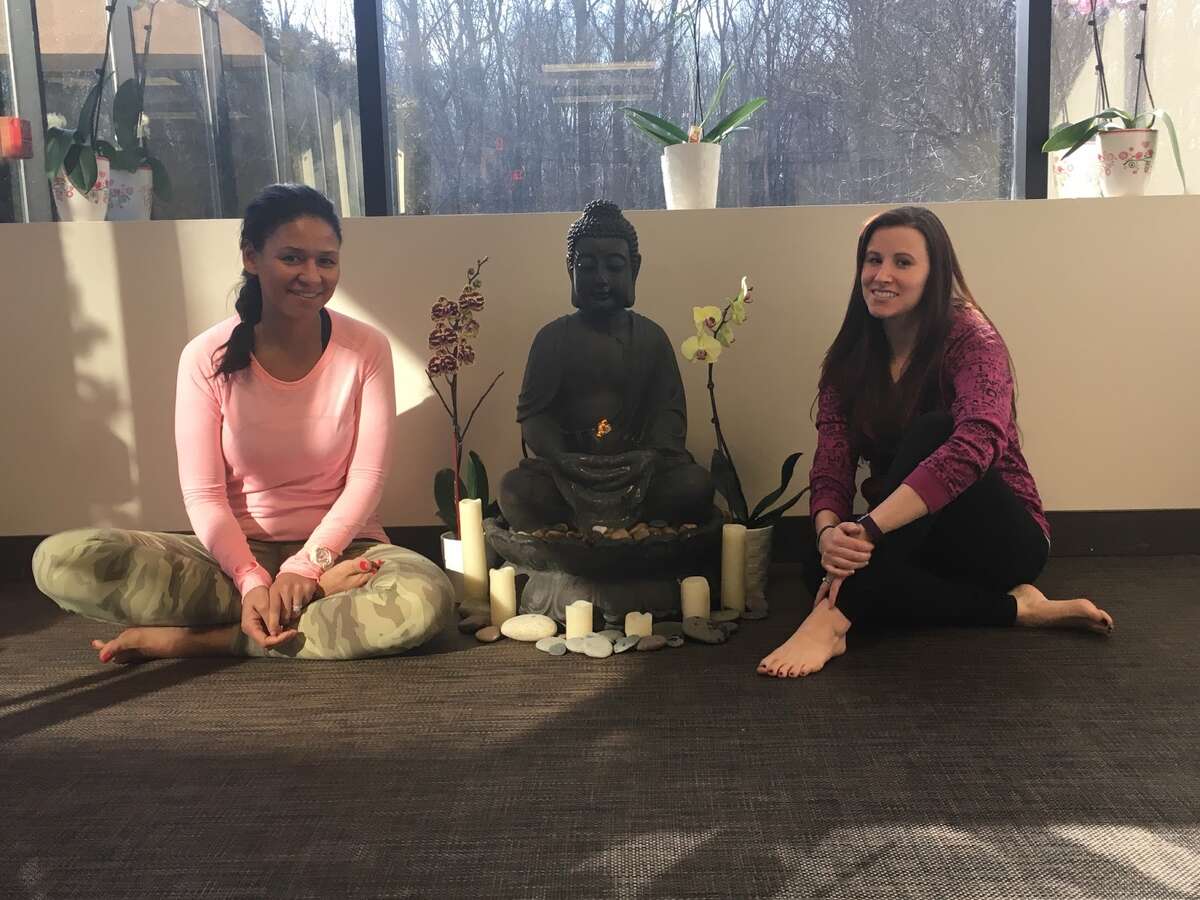 Zoey Schiavone and Cariann Tyszka are a part of the new staff that took over the business after 10 years. They instruct some of the new classes that don't rely on traditional Bikram techniques. - Aaron Berkowitz photo