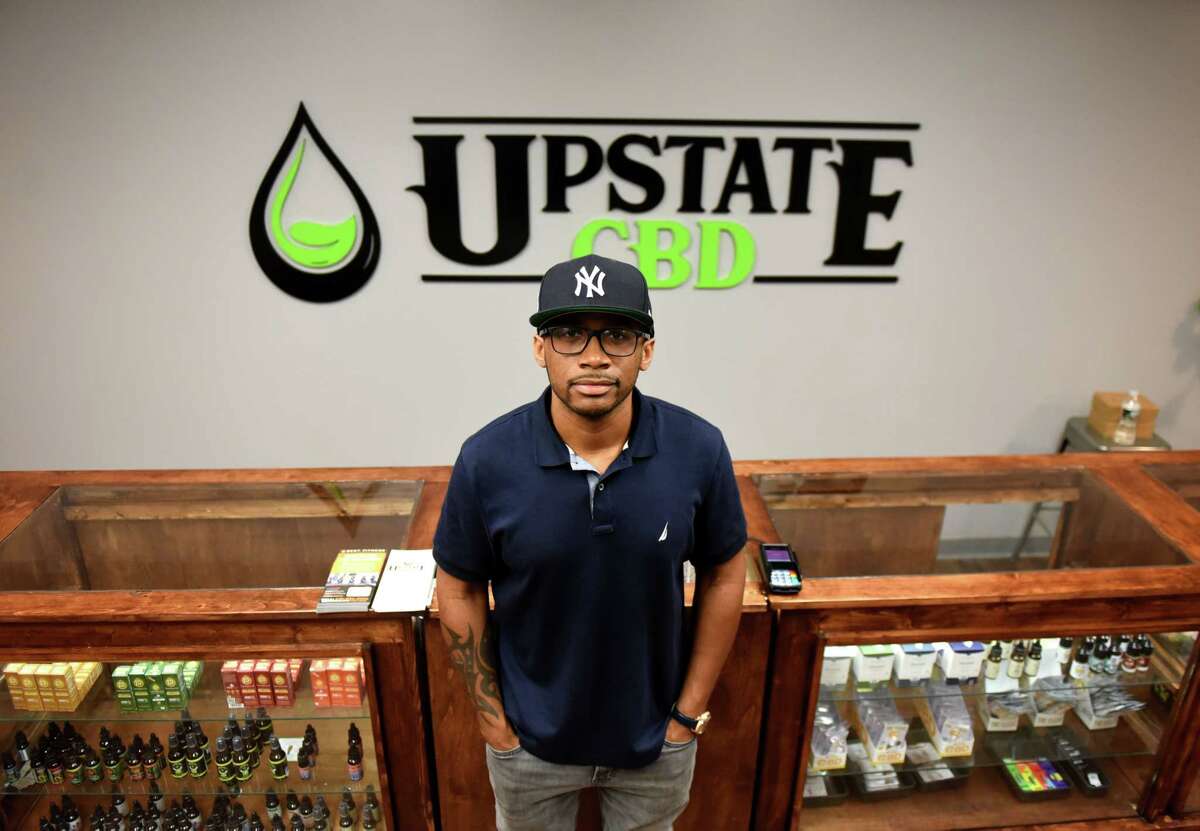 Donald Andrews, proprietor of Upstate CBD, stands in his Upper Union Street store on Tuesday, June 4, 2019, in Schenectady, N.Y. The shop offers CBD hemp buds, edibles, extractions, topicals and pet products. He hopes the business will give him a foothold should New York legalize recreational marijuana. (Will Waldron/Times Union)