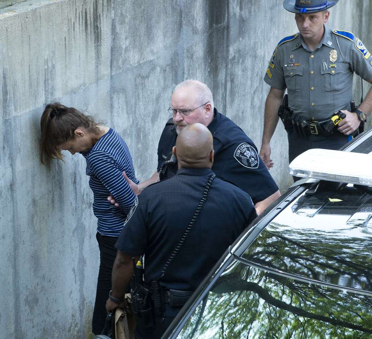 Michelle Troconis, 44, the girlfriend of Fotis Dulos, 51, is led into Norwalk Superior Court on Monday morning, June 3, 2019 by New Canaan police, judicial marshals and the state police. Troconis and Dulos were both arrested late Saturday night by state police detectives at a hotel in Avon and have been held on $500,000 bond pending arraignment in Norwalk Superior Court. Fotis Dulos, the estranged husband of missing New Canaan mother of five Jennifer Farber Dulos, has been charged in connection with the investigation into her disappearance. New Canaan police said Sunday they charged Fotis Dulos with hindering prosecution and tampering with evidence, along with Troconis (Patrick Raycraft/Hartford Courant/TNS)