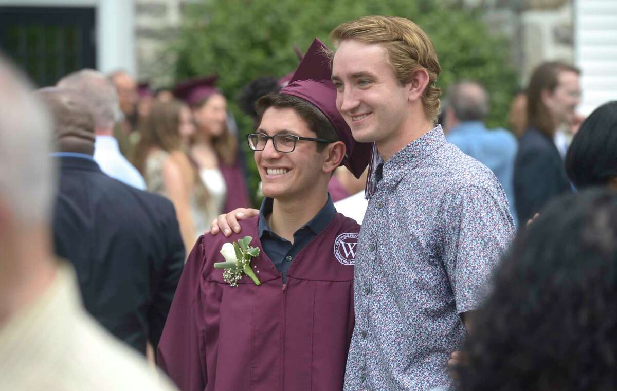 Jack Israel Barsh poses of a photo with Wooster alumni Sam Cox, class of 2017, after the Class of 2019 Wooster School Commencement, Friday morning, June 7, 2019, Danbury, Conn.