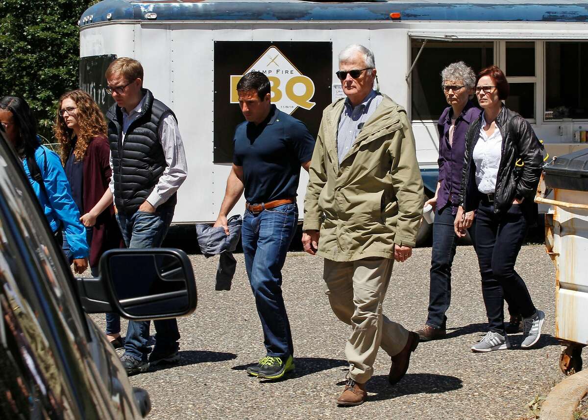Federal Judge Williams Alsup,(green jacket) a PG&E group into the back entrance into Paradise Performing Arts Center for a closed door meeting, in Paradise, Ca., on Friday June 7, 2019.