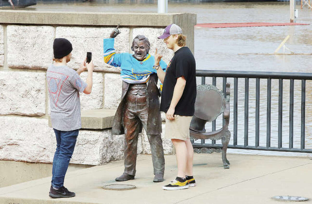 Flooding is turning out to be a major tourism attraction around the area. Two young floodwatchers, who were making the rounds around downtown’s flooded areas, decided to grab a picture after slipping a St. Louis Blues jersey on the statue of Stephen A. Douglas in Alton. The Blues defeated the Boston Bruins in Thursday night’s game 2-1 and are on the verge of winning their first ever Stanley Cup championship. The men took the jersey off after the photo.