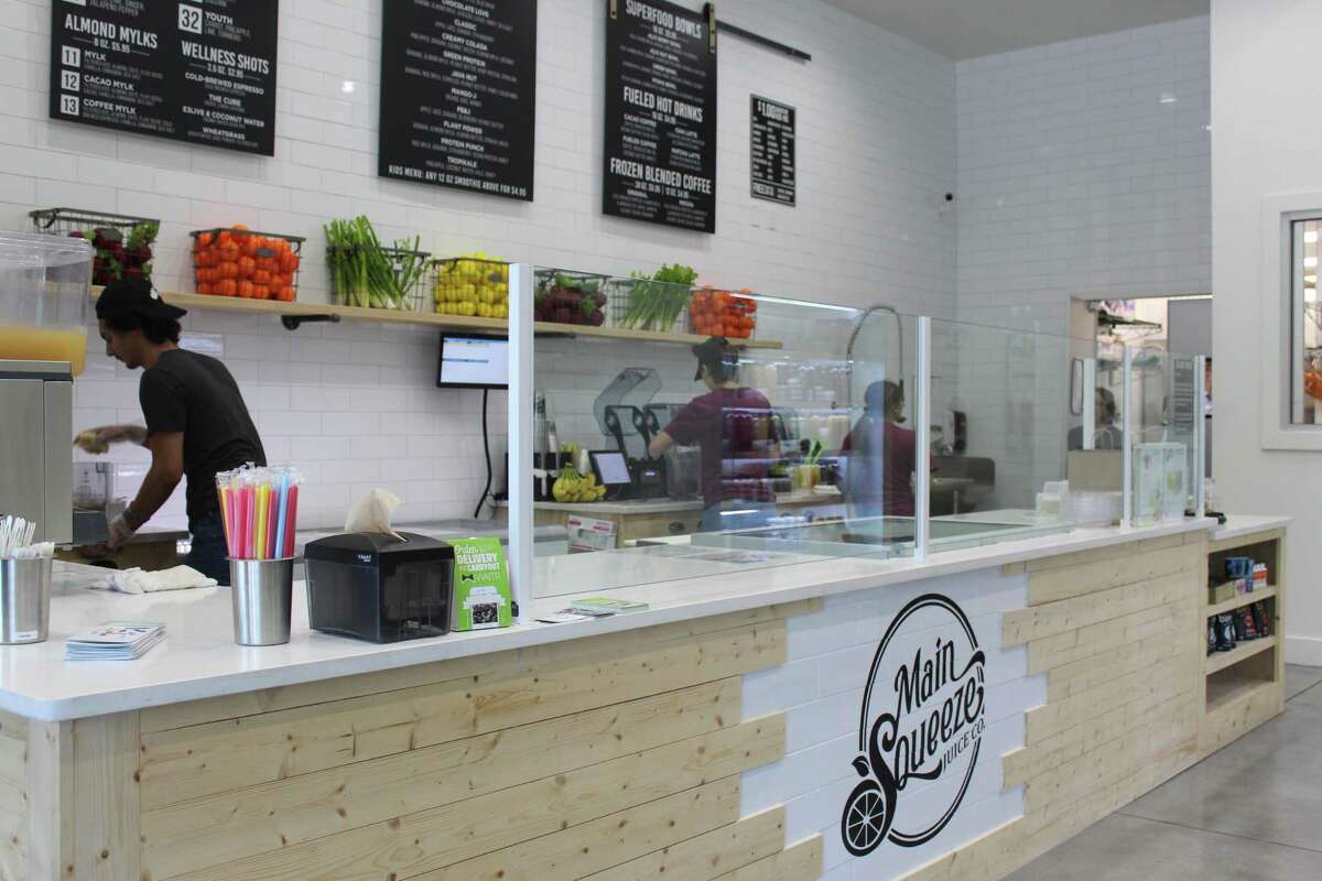 Main Squeeze Juice Company opened their fourth location in the Houston metro area in The Woodlands at 1900 Lake Woodlands Drive.
