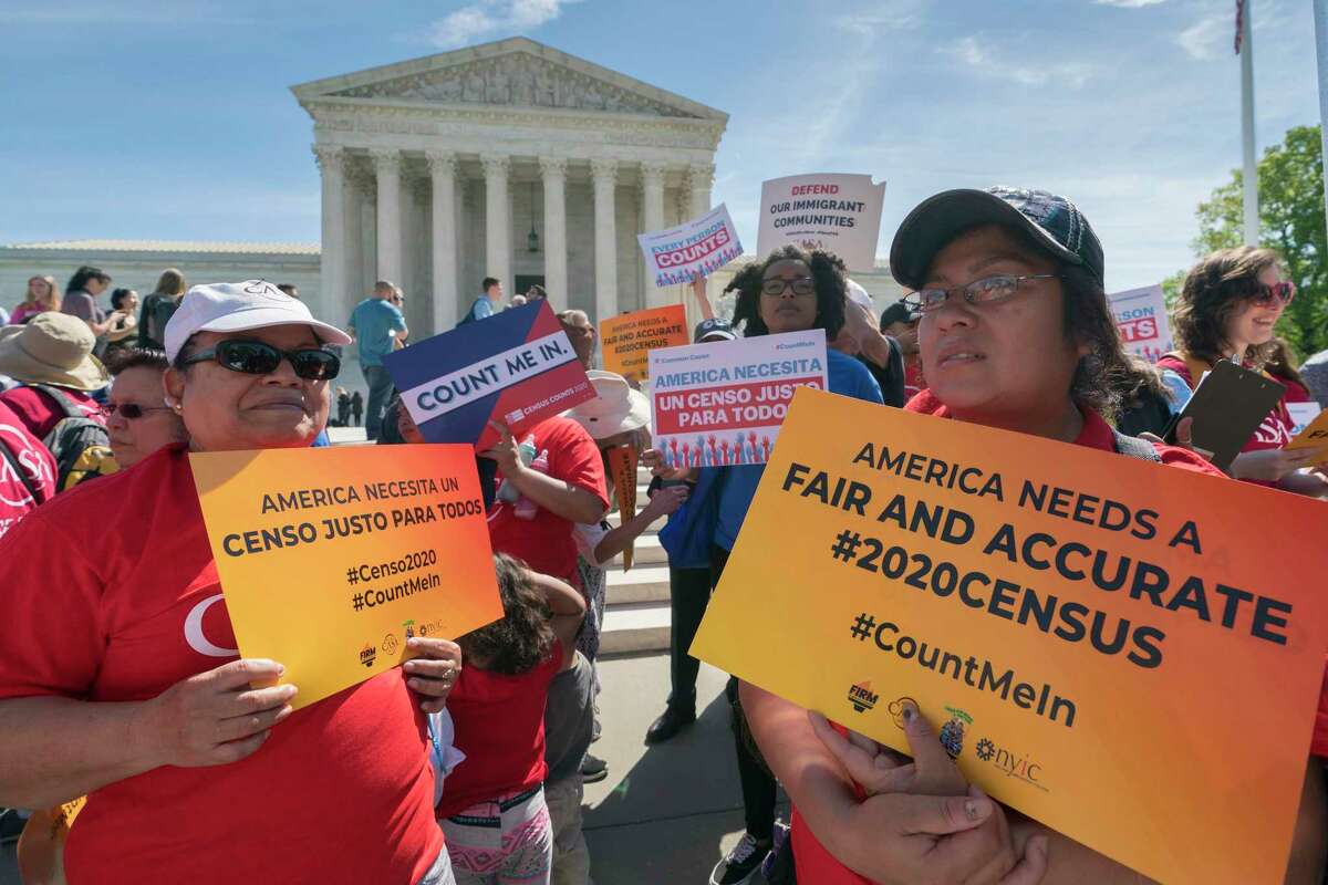 Activists rally in April outside the Supreme Court as the justices hear arguments over the plan to ask about citizenship on the 2020 census. Documents that surfaced after a GOP redistricting consultant died reveal the question was added to give Republicans an electoral advantage.