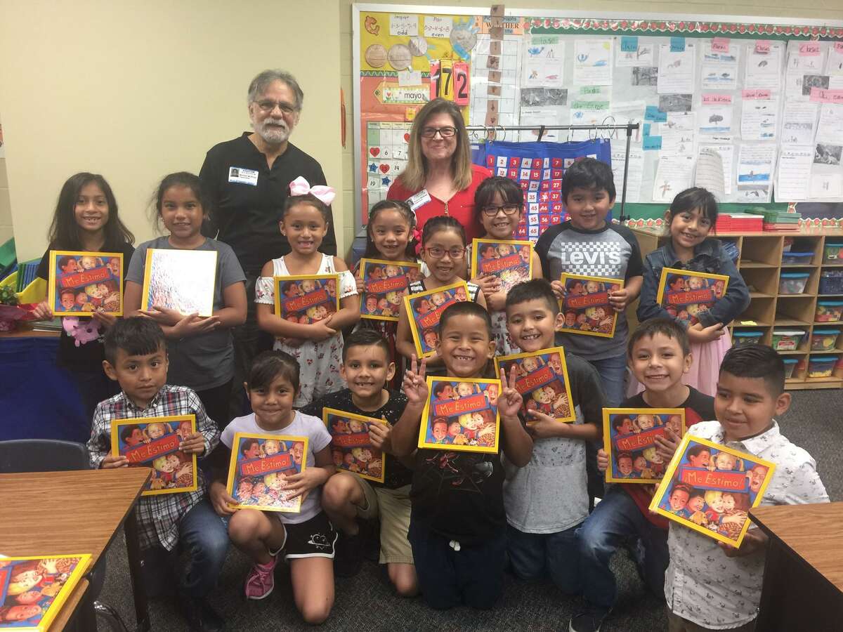 The distribution of I Like Me Books put smiles on the faces of these first grade students at Runyan Elementary School in late May, just before summer vacation. The Rotary Club of Conroe gives books to all first grade students in Conroe ISD north of the river each year. Pictured are Rotary members Kris and Nordstrom McBride giving out the “I Like Me” books at Ben Milam Elementary School.