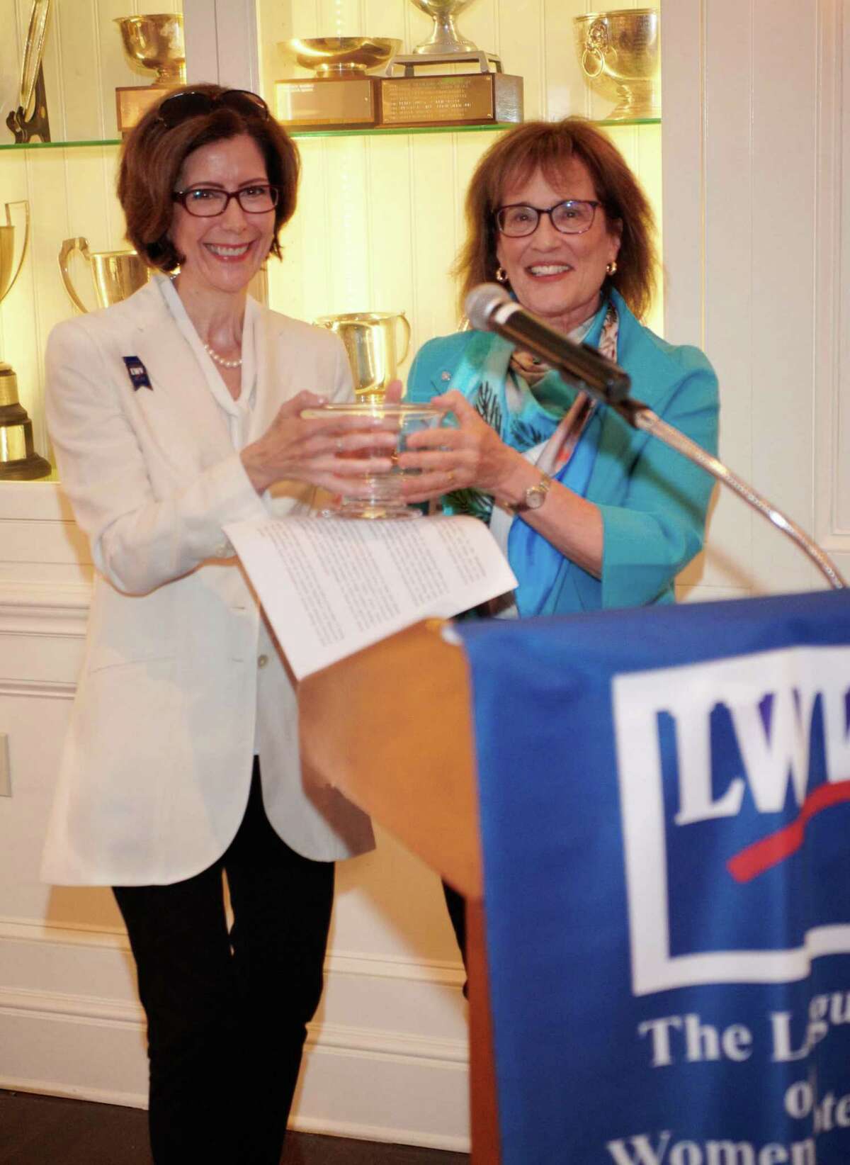 Deirdre Kamlani, at left is presented with the League of Women Voters of Greenwich’s Mary Award, for all of her work with the league by league member Nancy Duffy.