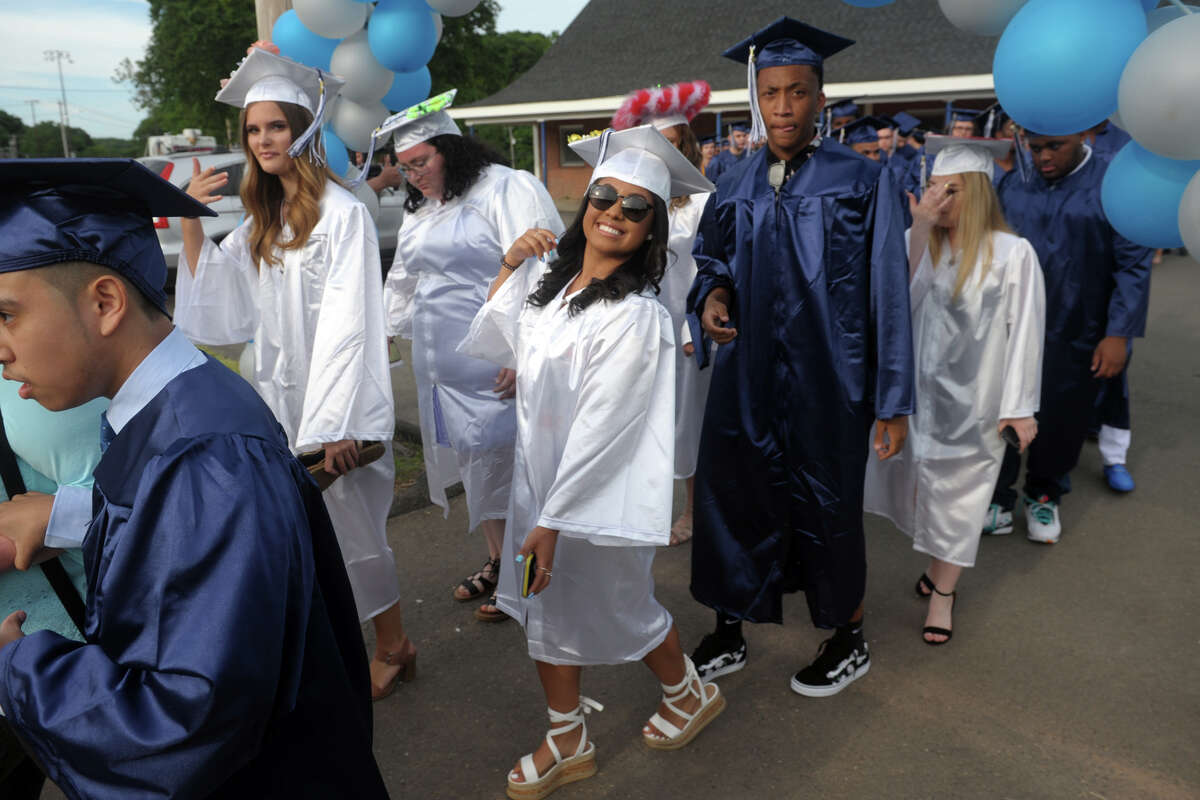 Members of the Ansonia High School Class of 2019 enter their graduation in Ansonia, Conn. June 7, 2019.