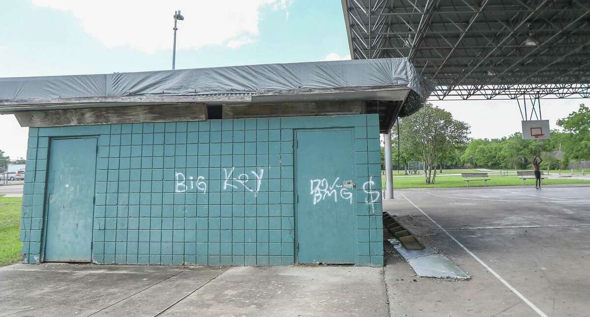 A small building has been tagged in Zollie Scales Park as a youth practices basketball Friday, June 7, 2019, in Houston. The park on Corder at Springhill was a scene where one person was killed during a party in June of 2018.