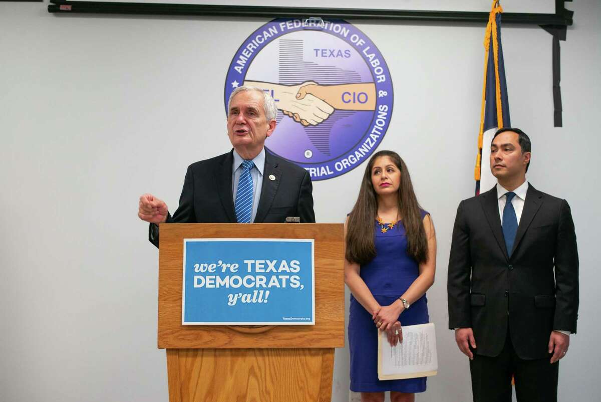 Congressman Lloyd Doggett talks with reporters at a news conference Friday about Gov. Greg Abbott’s possible involvement in a Secretary of State effort earlier this year to purge more than 95,000 Texans that it claimed were illegally registered to vote because they weren’t citizens. But the data was flawed and it turned out most of the people on the list were naturalized citizens and eligible to vote. Behind Doggett are United We Dream Co-Founder Julieta Garibay and Congressman Joaquin Castro.