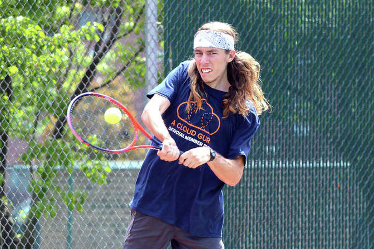 Former Edwardsville player Erik Weiler, who will be a junior at Quincy University, returns a shot during his first-round match in men’s open singles on Friday in the Edwardsville Open at the EHS Tennis Center.
