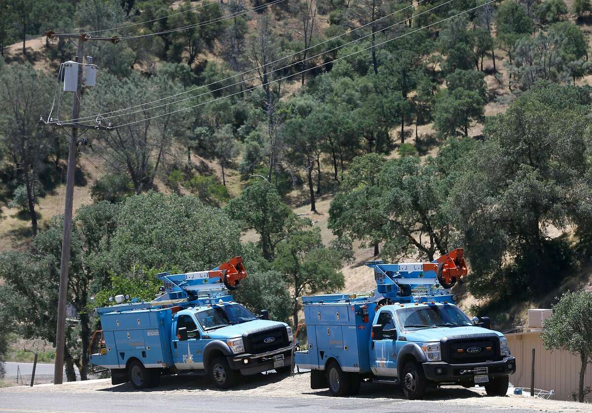 A PG&E crew is stationed on Spanish Flat Loop Road to observe overhead power lines and monitor wind conditions in Lake Berryessa, Calif. on Saturday, June 8, 2019. PG&E enabled its public power safety shutoff protocol resulting in outages for 1,600 customers in the area.