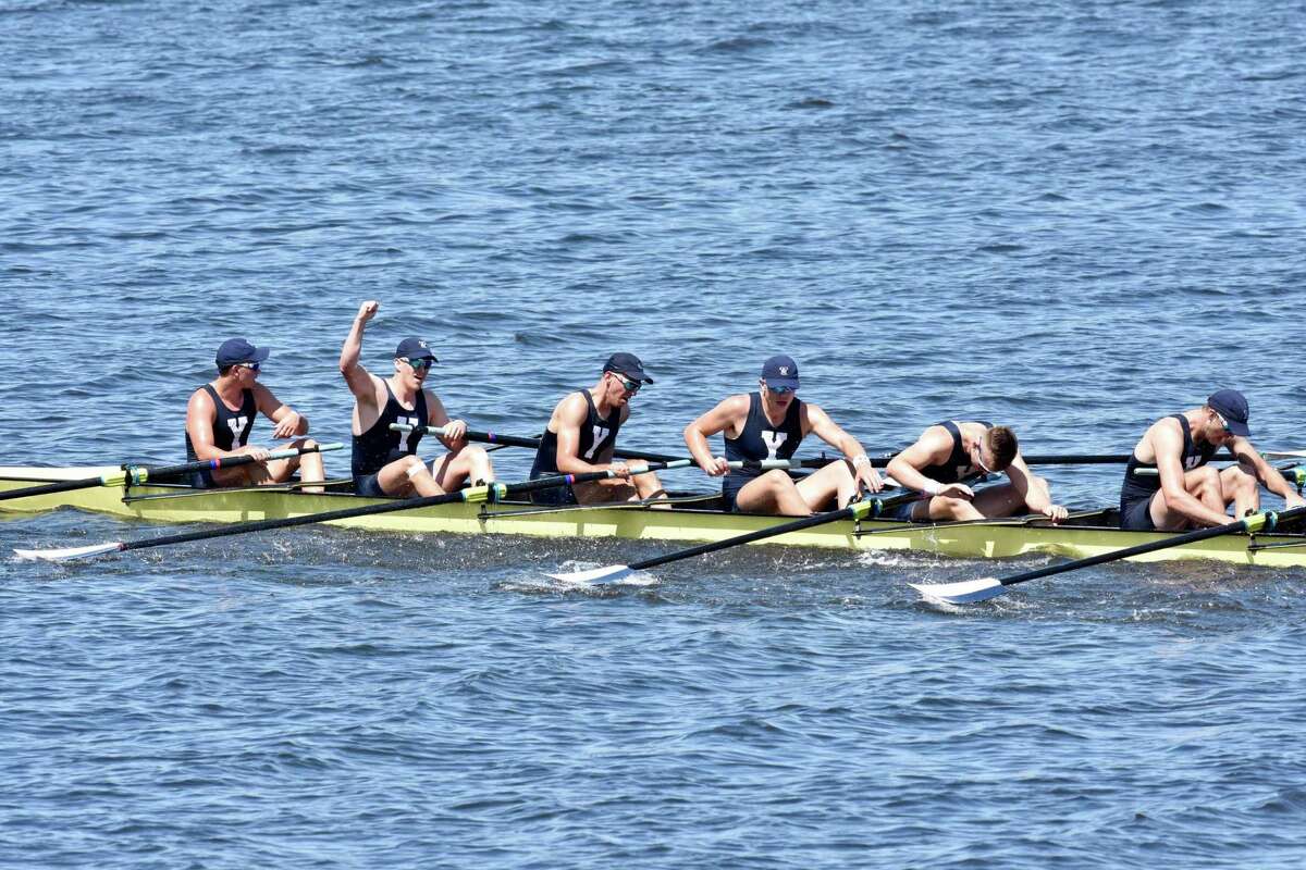 Members of the Yale first varsity crew celebrate their win over rival Harvard in the annual Regatta on Saturday.