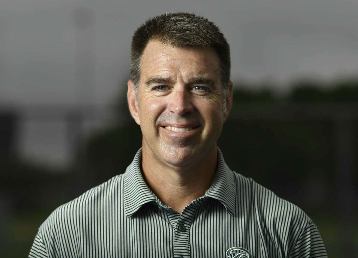 David Daniel, Reagan tennis coach, is the Express-News coach of the year.