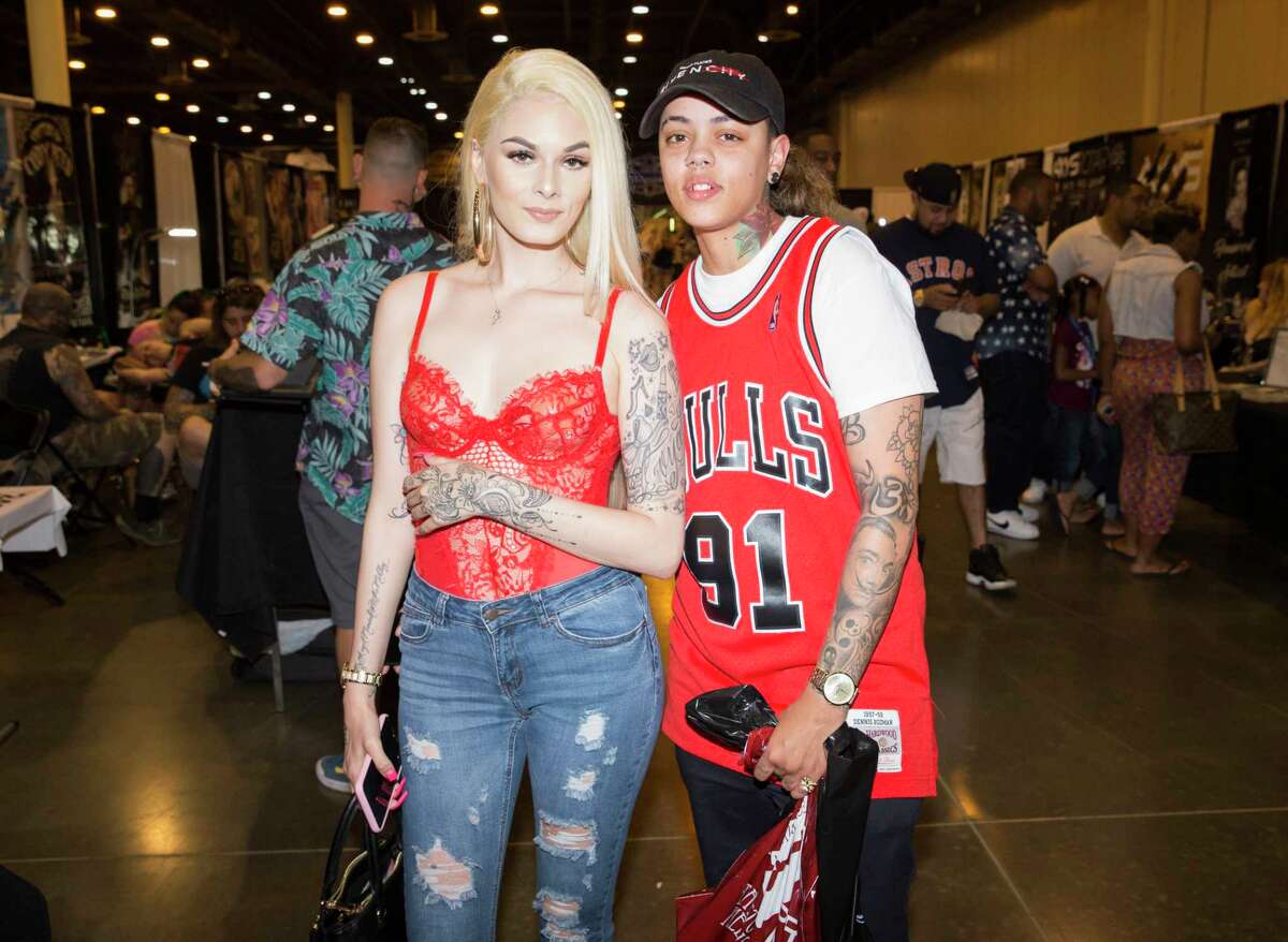 People pose for a photograph at the 2nd Annual Houston Tattoo Arts Convention at NRG Center on Saturday, June 8, 2019, in Houston.