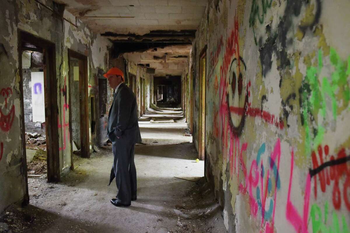 Saratoga County Attorney Stephen Dorsey walks down the hallway inside of the Homestead Asylum on Thursday, May 23, 2019 in Middle Grove, NY. (Phoebe Sheehan/Times Union)