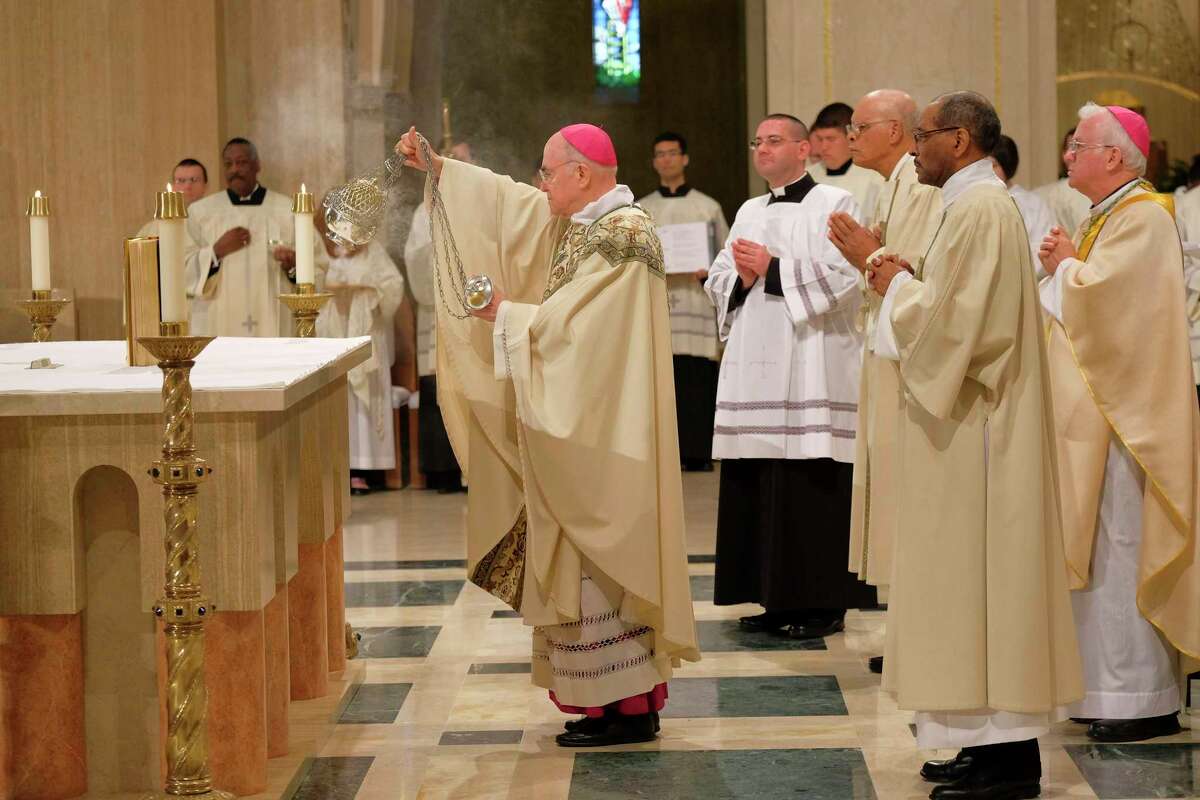 Archbishop Carlo Maria Vigano, then the Vatican's ambassador to the United States, blesses the altar at the Basilica of the National Shrine of the Immaculate Conception on March 24, 2016.