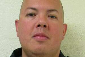 Corporal Justin Storlie, 35, was arrested Monday on a domestic violence charge.