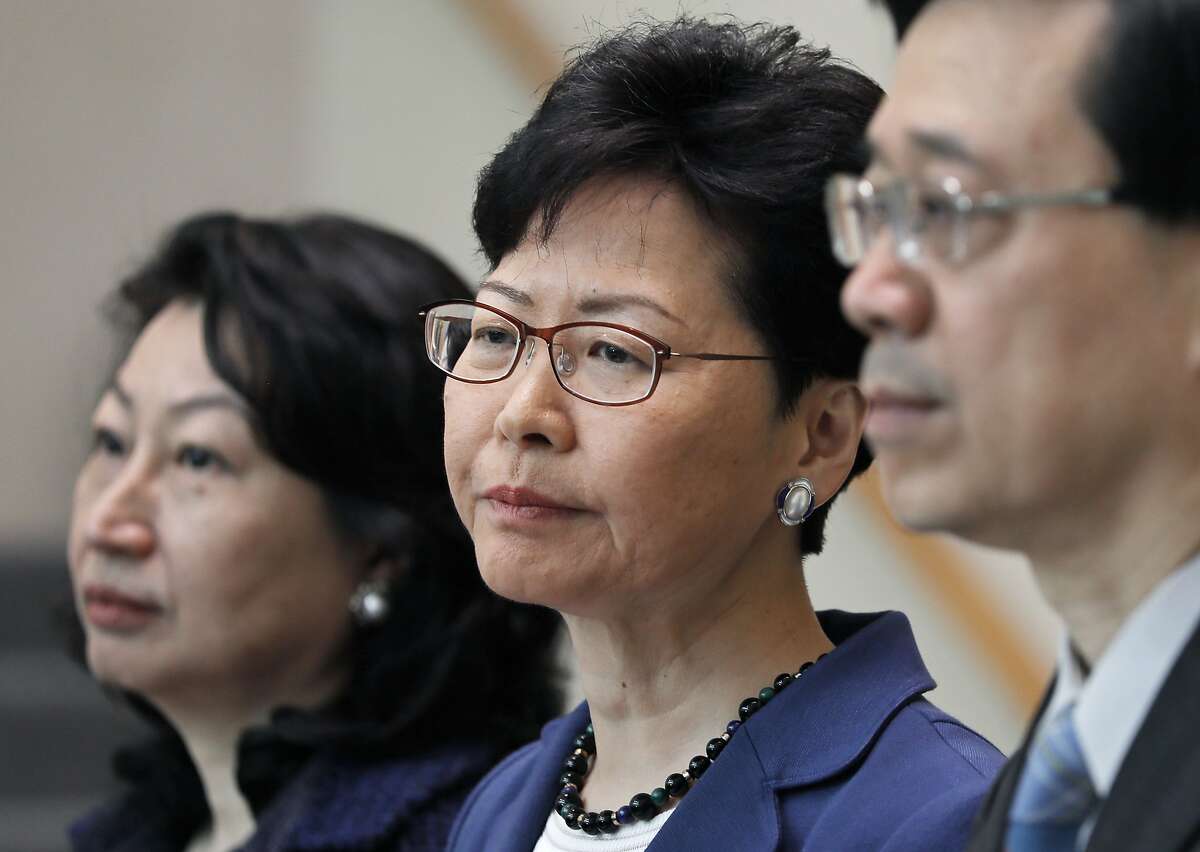 From right, Hong Kong Secretary for Security John Lee, Hong Kong Chief Executive Carrie Lam and Secretary of Justice Teresa Cheng listen to reporters questions during a press conference in Hong Kong Monday, June 10, 2019. Lam signaled Monday that her government will go ahead with proposed amendments to its extradition laws after a massive protest against them. (AP Photo/Vincent Yu)