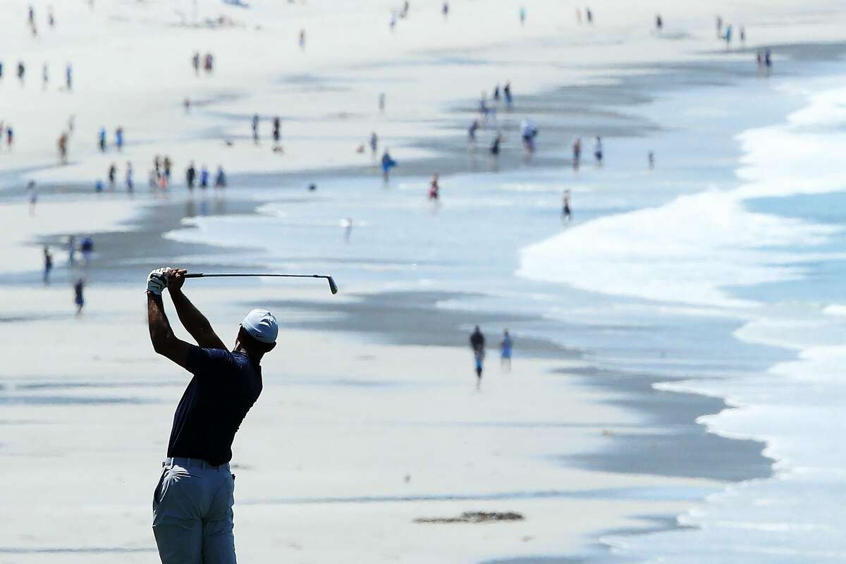 PEBBLE BEACH, CALIFORNIA - JUNE 10: Tiger Woods of the United States plays a second shot on the ninth hole during a practice round prior to the 2019 U.S. Open at Pebble Beach Golf Links on June 10, 2019 in Pebble Beach, California. (Photo by Andrew Redington/Getty Images)