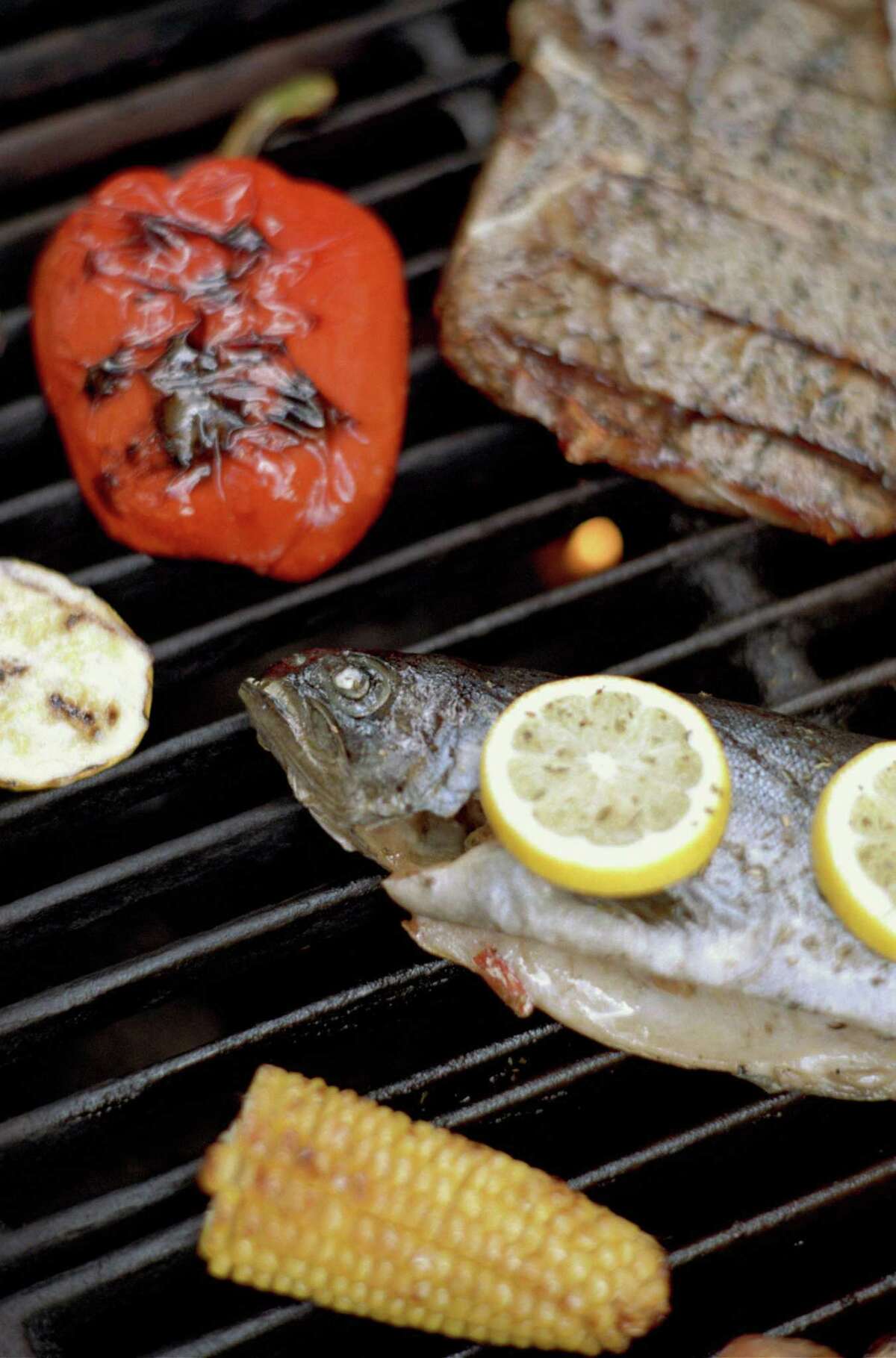 Throw some trout and veggies on the grill along with your steak.