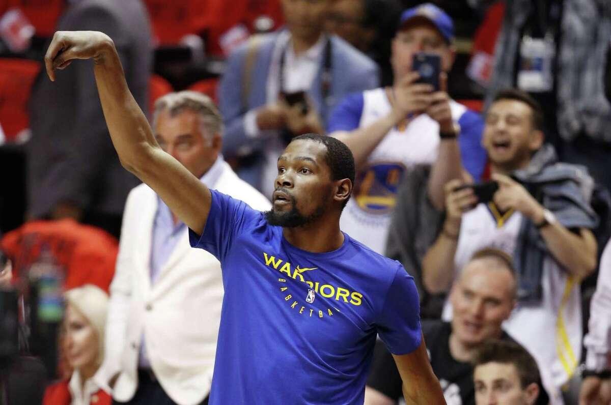 Golden State Warriors' Kevin Durant warms up before playing against Toronto Raptors in NBA Finals' Game 5 at Scotiabank Arena in Toronto, Ontario, on Monday, June 10, 2019.
