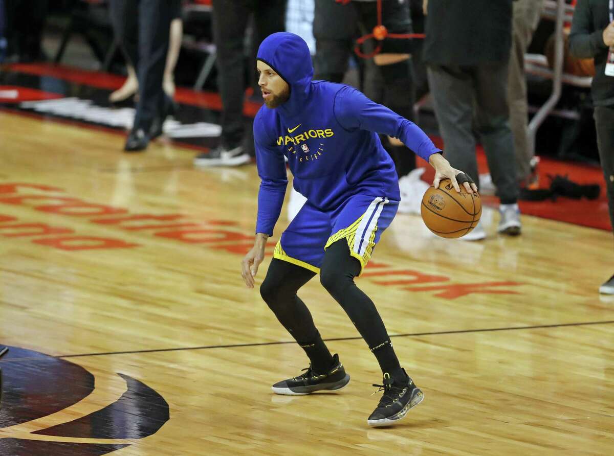 Golden State Warriors' Stephen Curry warms up before playing against Toronto Raptors in NBA Finals' Game 5 at Scotiabank Arena in Toronto, Ontario, on Monday, June 10, 2019.