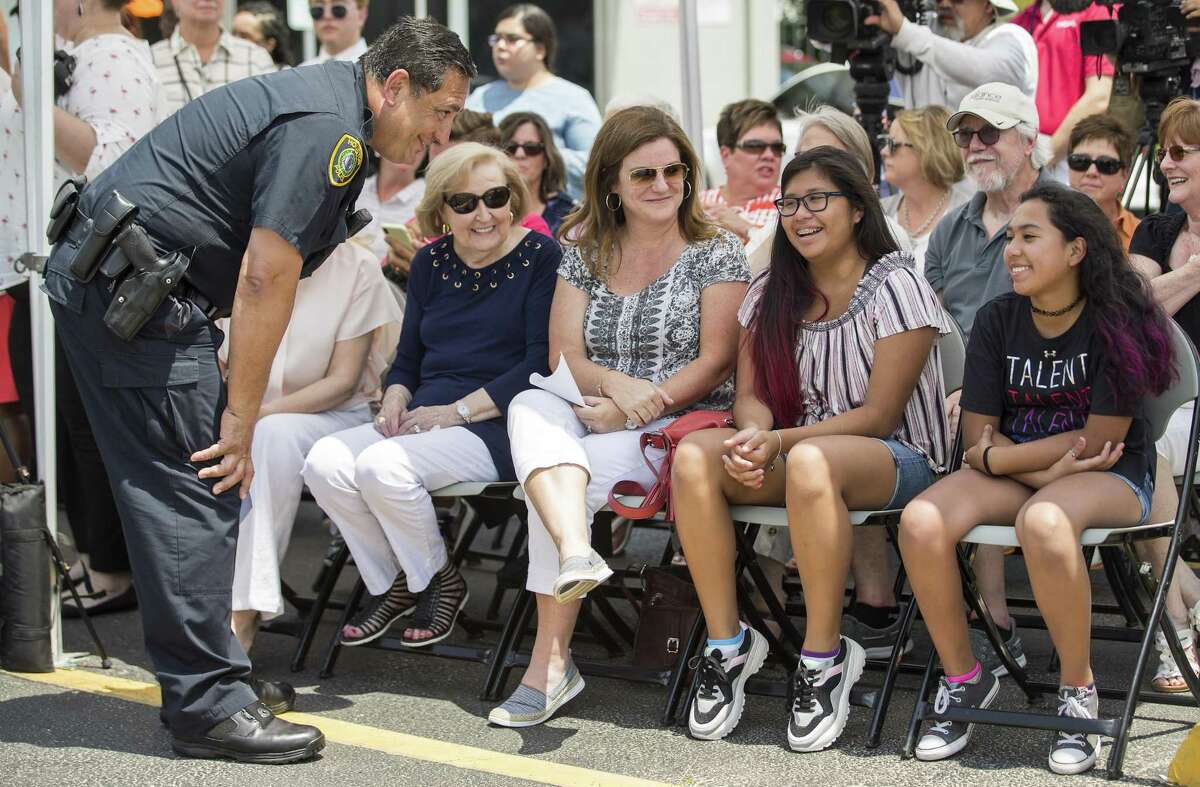 Houston Police Chief Art Acevedo greets the family of Lesha Adams, from left, Ruth Adams, Stephanie Marsh, Olivia Adams-Marsh and Ava Adams Marsh, as he arrives to news conference to mark the installation of a crosswalk near 10th and Shepherd as part of the city's Safer Streets initiative on Monday, June 10, 2019, in Houston. The traffic signal was installed at the location where Lesha Adams was helping Jesus Perez, who was in a wheelchair, cross the street on March 30 and were hit and killed by a car at the intersection.