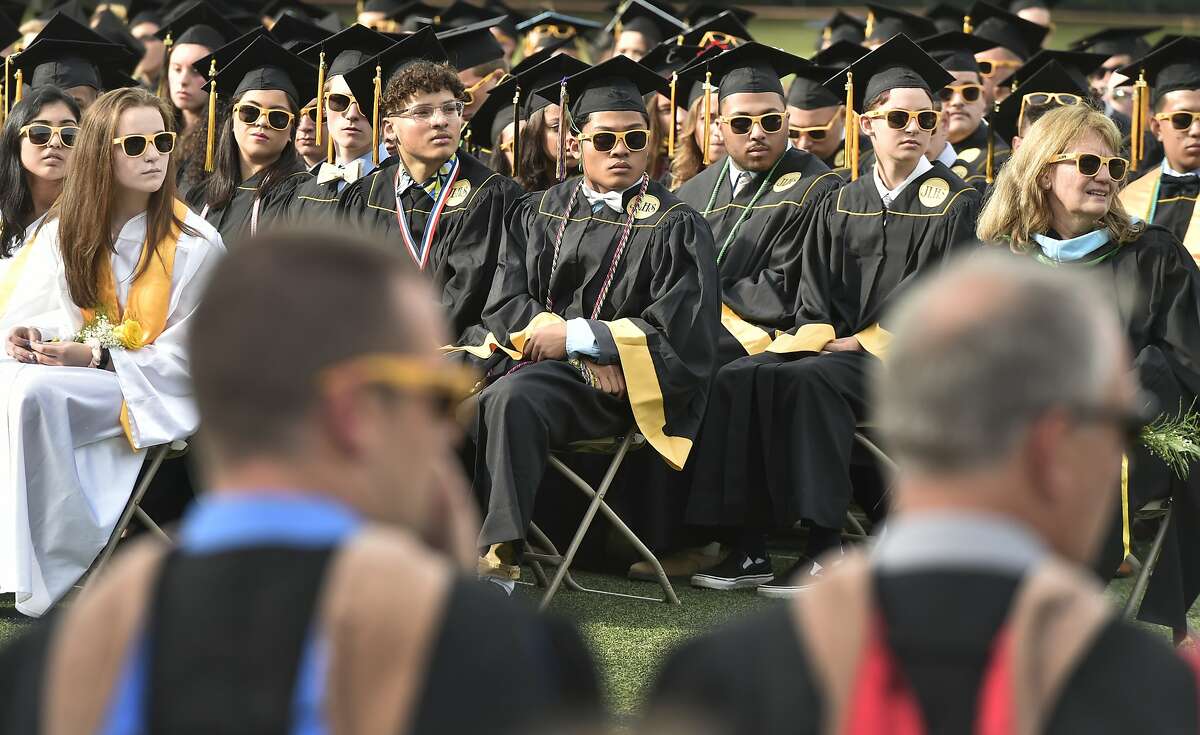 Milford, Connecticut - Friday, June 7, 2019: Graduating seniors listen to the Concert Choir during the Jonathan Law High School of Milford 2019 Graduation exercises Friday evening at the Law H.S. football field.