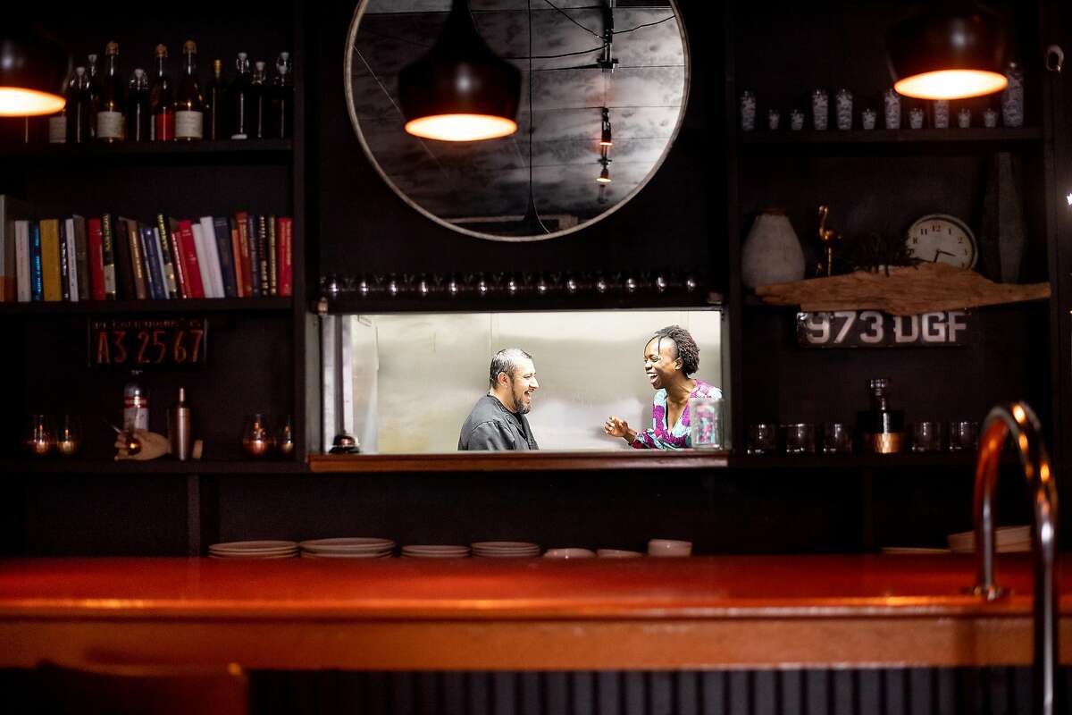 Simileoluwa Adebajo, who quit her job in finance to launch Eko Kitchen, speaks with fellow restauranteur Francisco Cazares on Monday, April 8, 2019, in San Francisco. The two will share the space former occupied by Joint Venture Kitchen for their respective ventures.