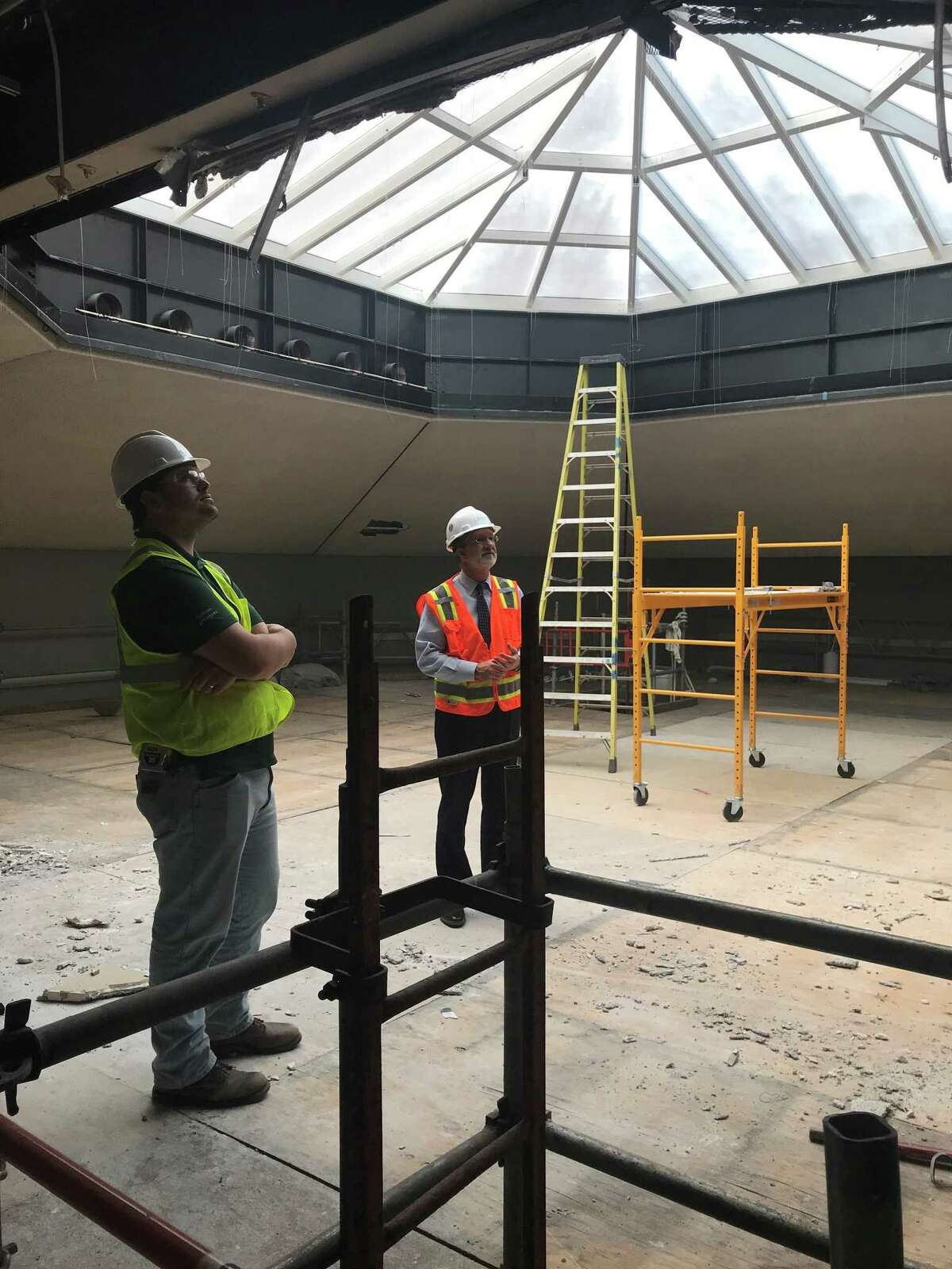 Marshall McBurnett, a project engineer with Linbeck, left, looks at renovation work being done near the ceiling of the Rothko Chapel with Rothko executive director David Leslie on Tuesday, April 2, 2019.
