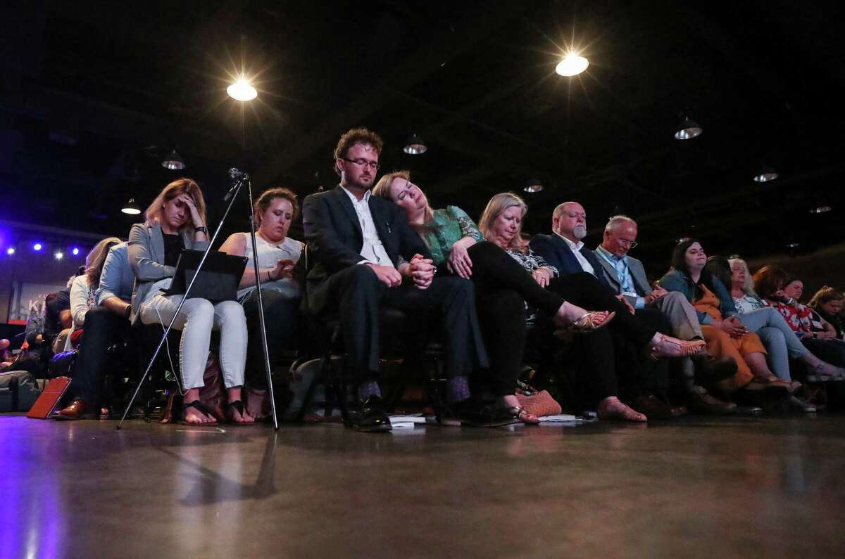 People pray during a panel discussion about sexual abuse and the Southern Baptist Convention, on the eve of the SBC's annual meeting on Monday, June 10, 2019, in Birmingham.