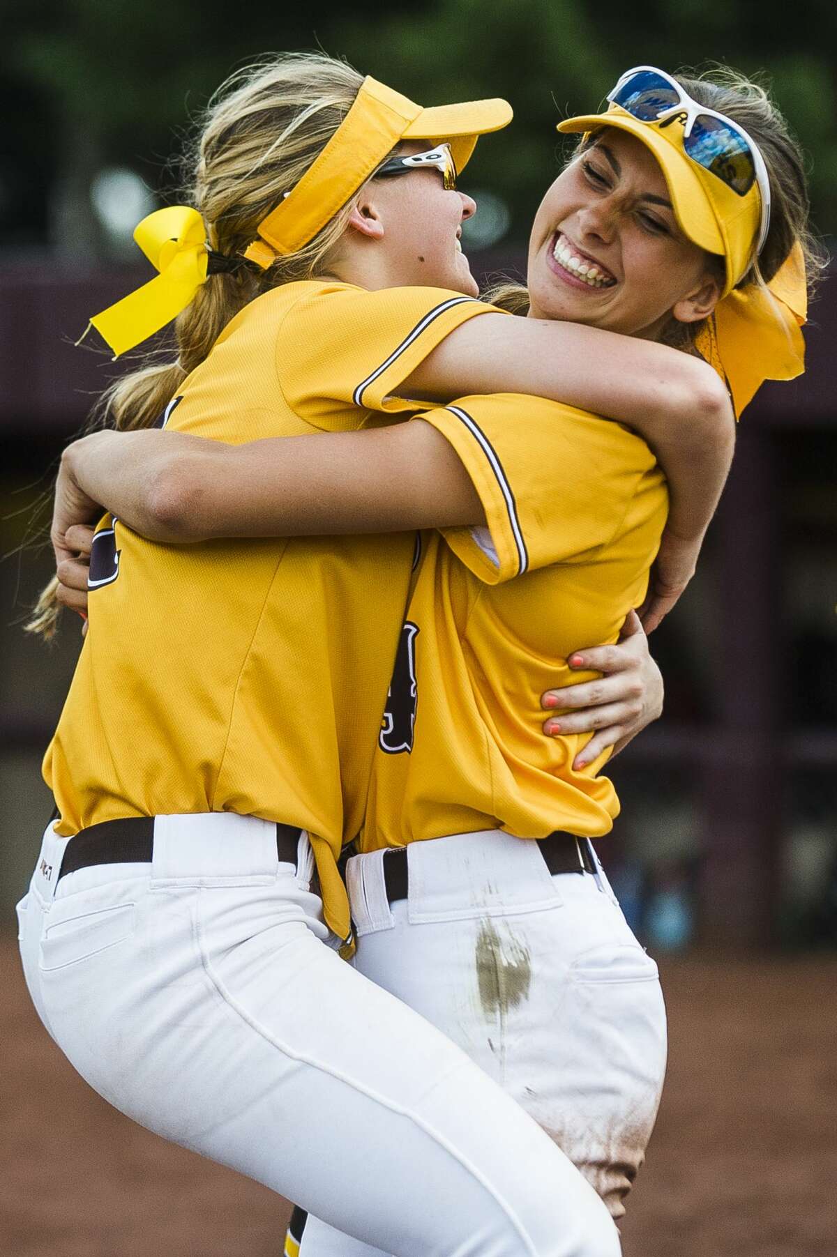 Bay City Western players celebrate after their Division 1 state quarterfinals victory over Lowell on Tuesday, June 11, 2019 at Central Michigan University. (Katy Kildee/kkildee@mdn.net)