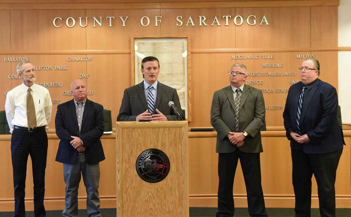 Clifton Park Town Supervisor Phil Barrett speaks as Saratoga County politicians announce usages for the money it will earn by selling its landfill during a press conference at the Saratoga County Office Building on Tuesday, June 11, 2019 in Ballston Spa N.Y. Standing in back of him, from left, are Malta Town Supervisor Darren O'Connor, Milton Town Supervisor Scott Ostrander, Ballston Town Supervisor Tim Szczepaniak, and Halfmoon Town Supervisor Kevin Tollisen. (Lori Van Buren/Times Union)