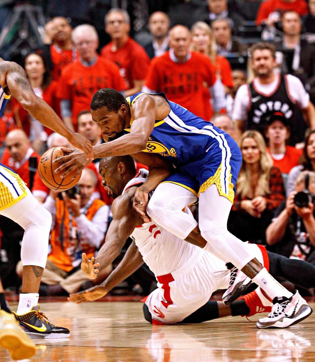 Golden State Warriors� Kevin Durant gets tripped up on Toronto Raptors� Serge Ibaka in the first quarter during game 5 of the NBA Finals between the Golden State Warriors and the Toronto Raptors at Scotiabank Arena on Monday, June 10, 2019 in Toronto, Ontario, Canada.