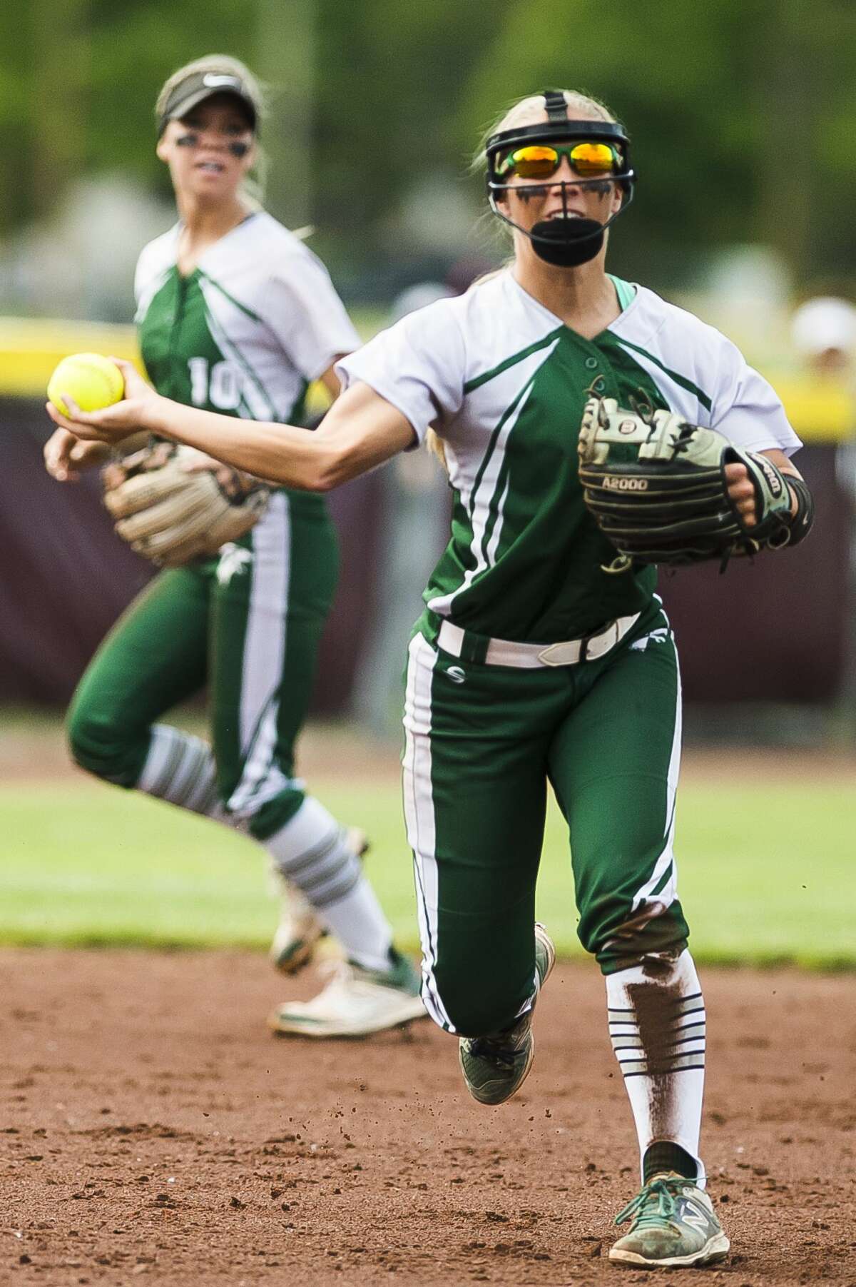Freeland's Camryn Coonan throws the ball to first base during the Falcons' Division 2 state quarterfinals loss to Escanaba on Tuesday, June 11, 2019 at Central Michigan University. (Katy Kildee/kkildee@mdn.net)