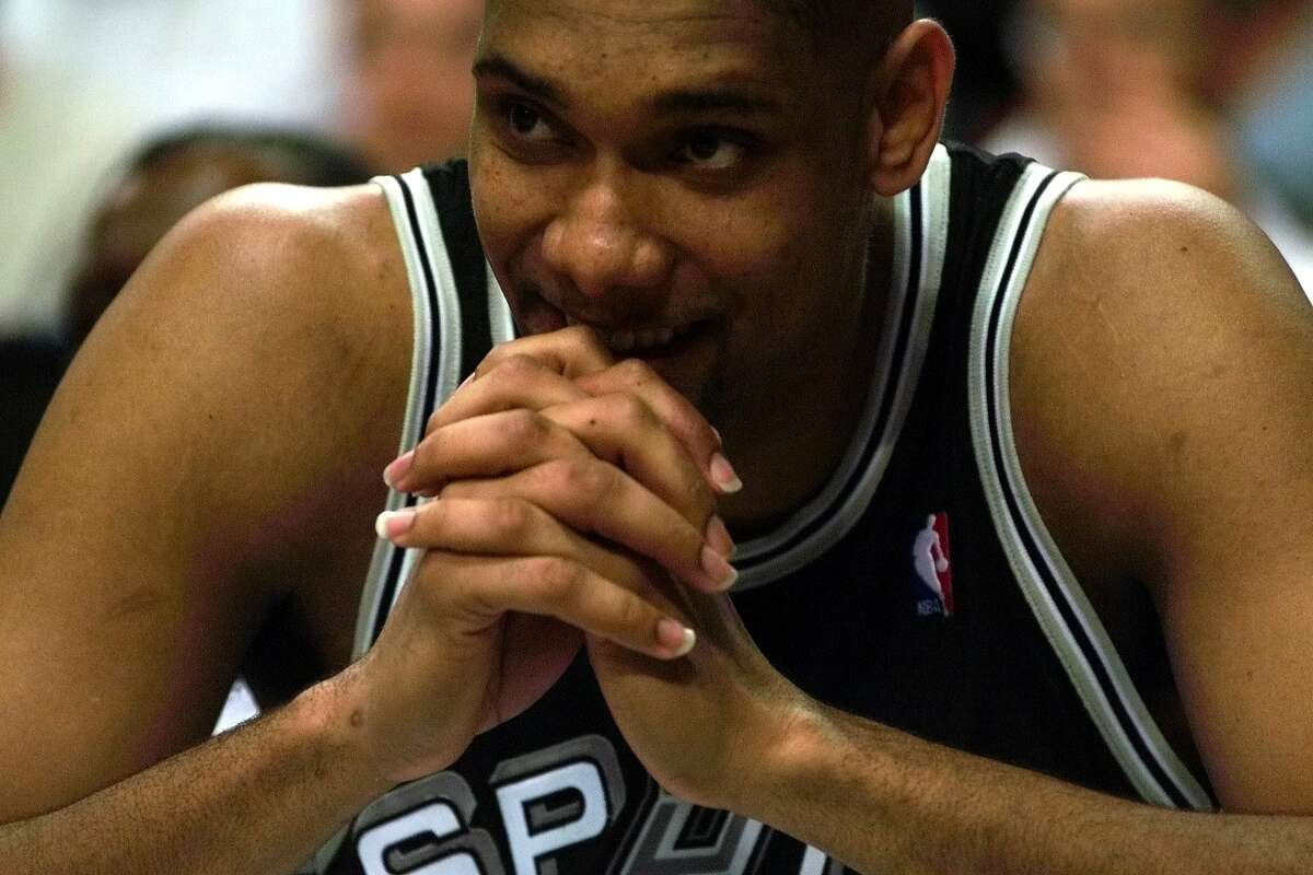 INSIGHT / ADVANCE FOR LINDA VAUGHAN -- Tim Duncan cant help but hold back a smile as the Spurs close oot a win against the Blazers during game 3 of the Western Conference Finals Friday June 4, 1999 at the Rose Garden in Portland, Oregon. Duncan spent most of the game on the bench(EXPRESS NEWS PHOTO/DELCIA LOPEZ )
