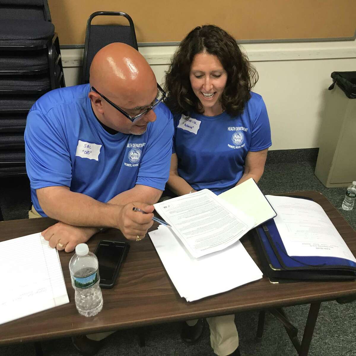 Savatore Nesci, Cromwell’s public health coordinator scans data from the exercise with Alberina Fletcher, his administrative secretary. The data compiled during the exercise and the results of an on-site evaluation conducted by Southington health officials will be used as part of a “hot wash” review designed to identify any errors.