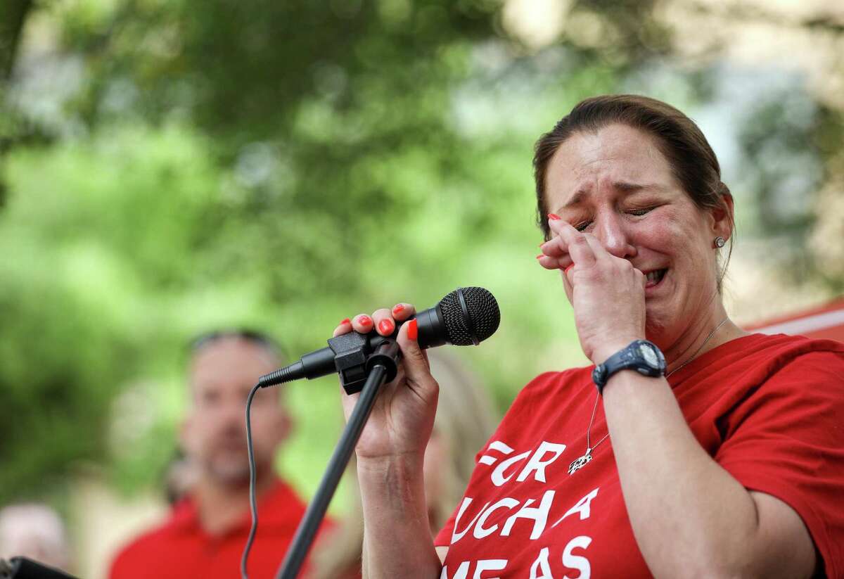 Jules Woodson, a sexual assault survivor, cries as she tells her story during a rally on the first day of the Southern Baptist Convention's annual meeting on Tuesday, June 11, 2019, in Birmingham.