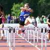 Tess Stapleton (center) of Fairfield Ludlowe runs to a first place finish in the 100 meter hurdles at the CIAC State Open Outdoor Track & Field Championship in New Britain on June 3, 2019.