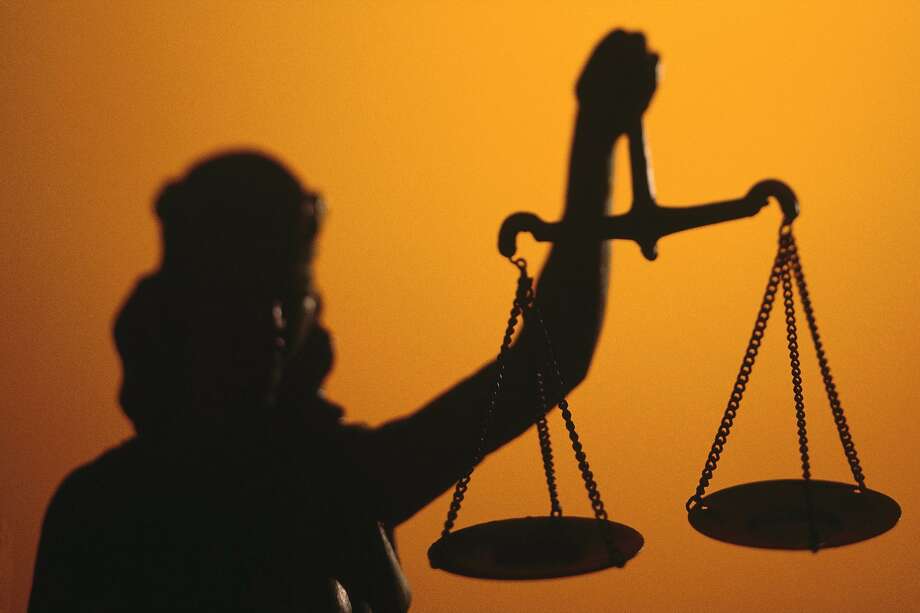 Silhouette of scales of Lady Justice holding scales Photo: Comstock / Getty Images / 2016